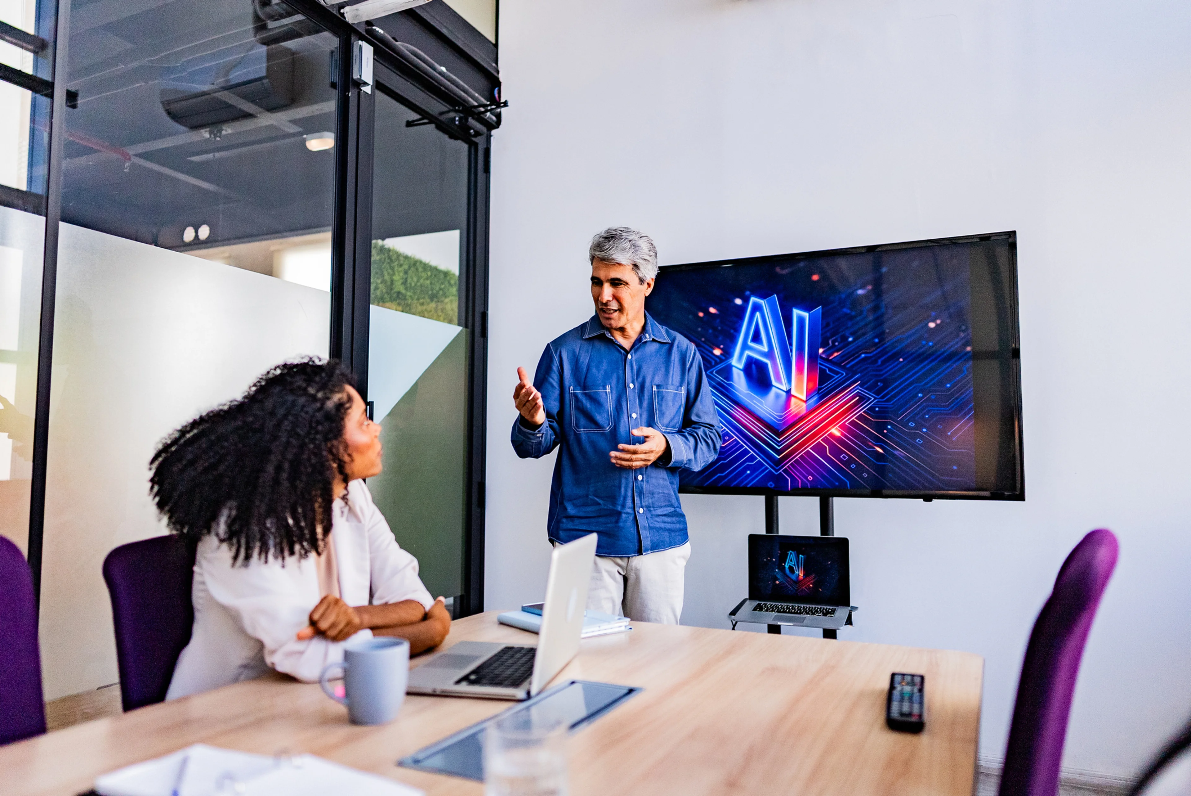Coworkers collaborating on AI project during business meeting in office