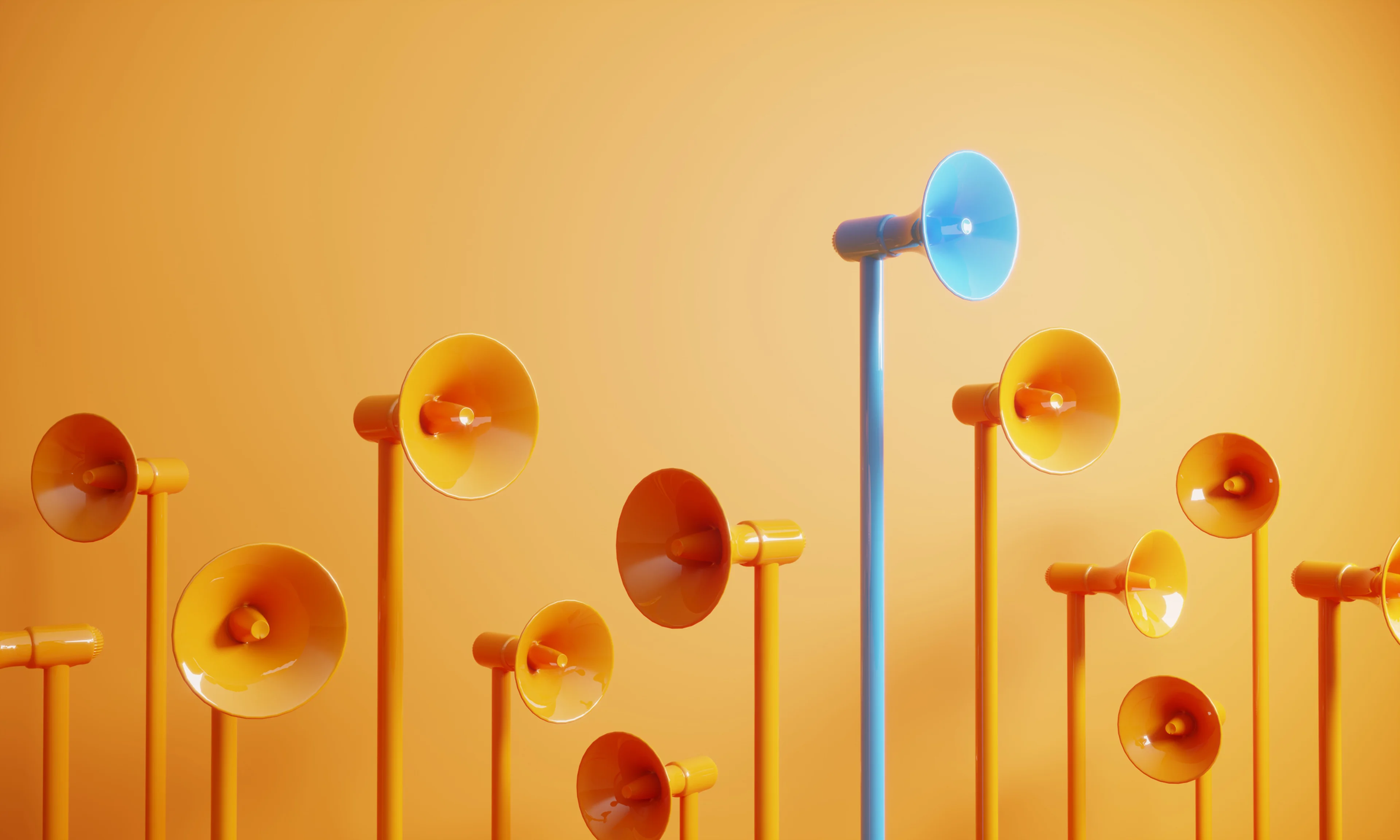Orange megaphones and a blue megaphone standing taller than the rest.