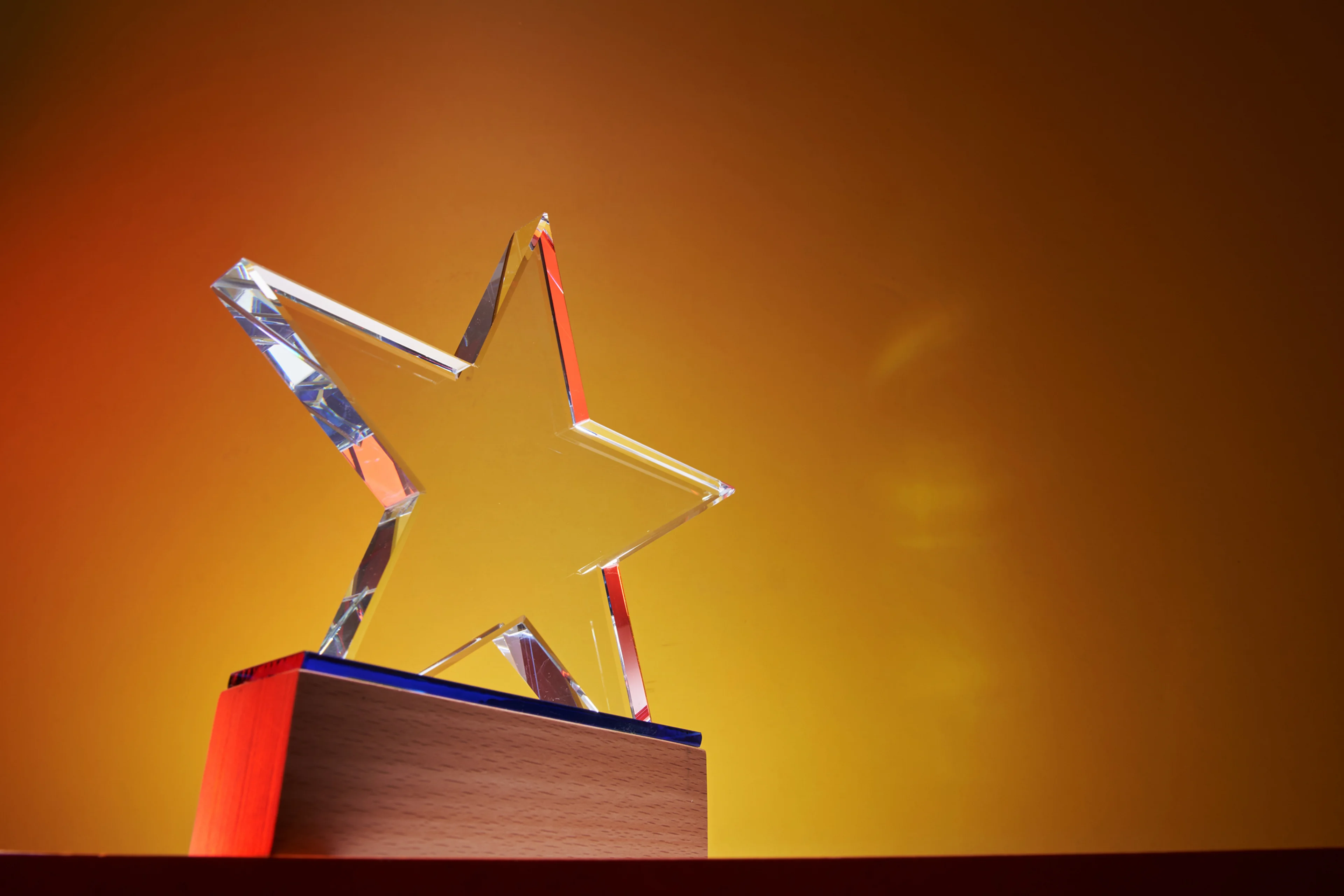 Gold background with a star award.