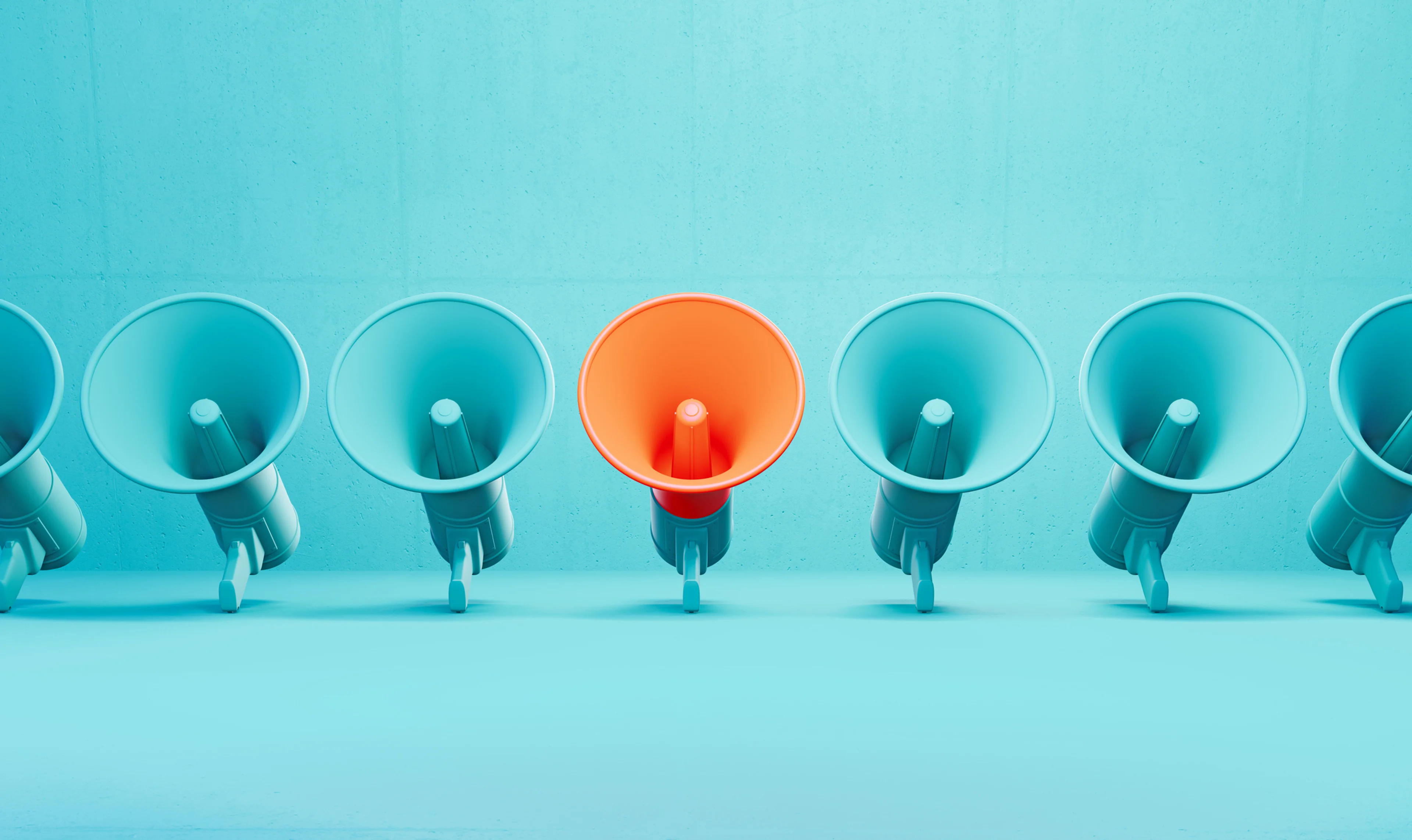 Blue megaphones and an orange megaphone in the middle.