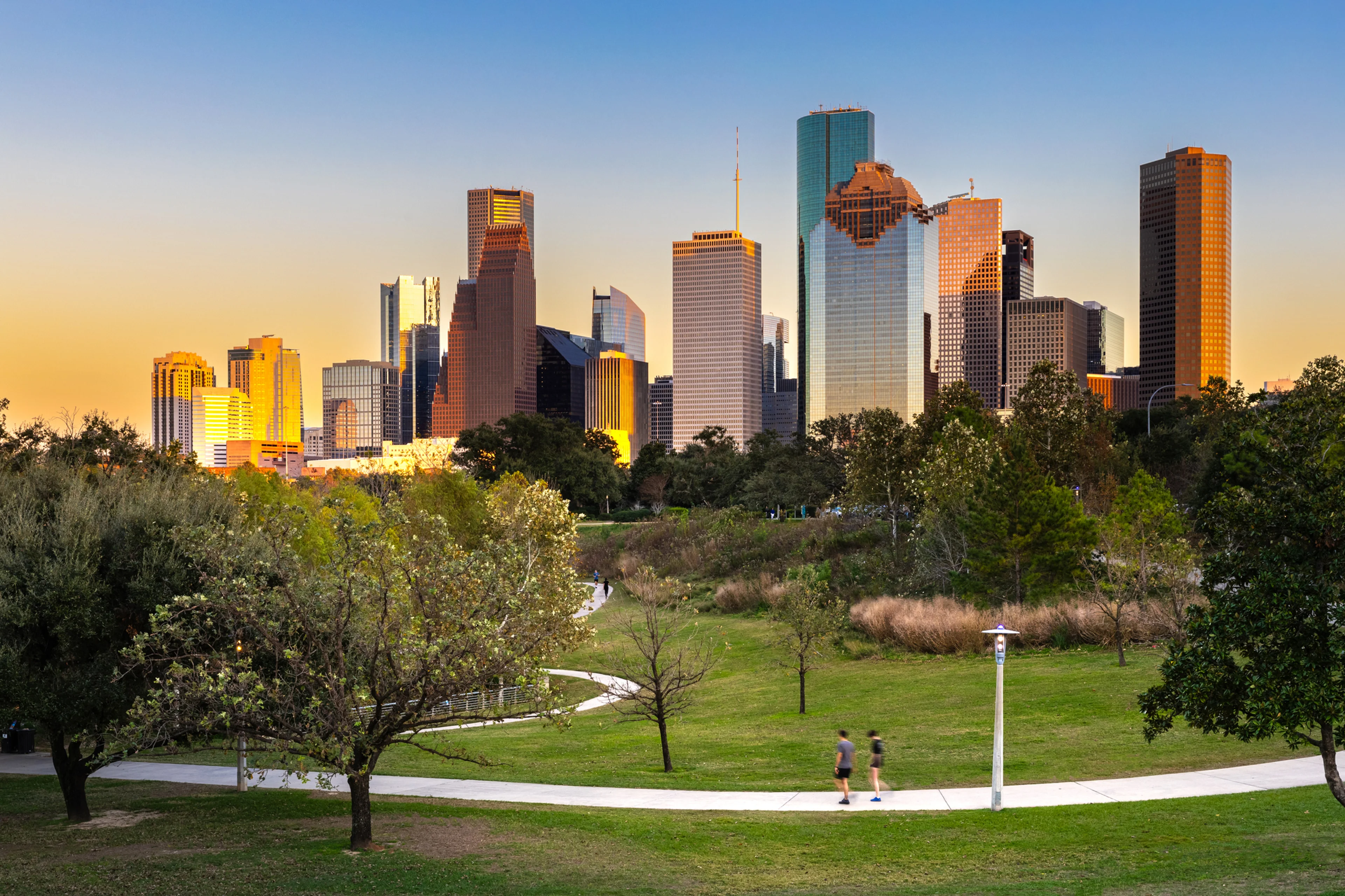 Downtown Houston skyline buildings at sunset.