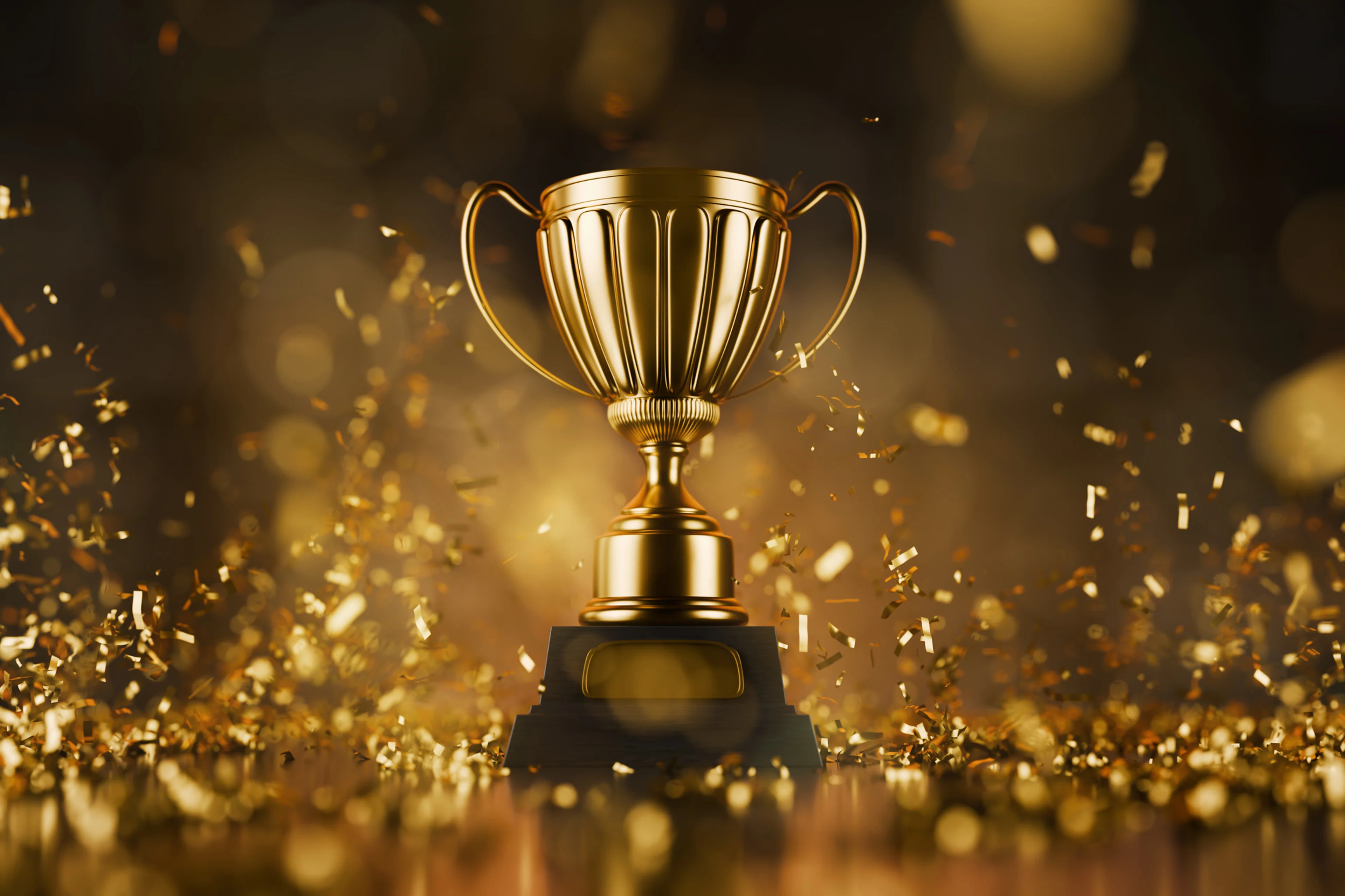 Gold trophy with gold confetti in the background.