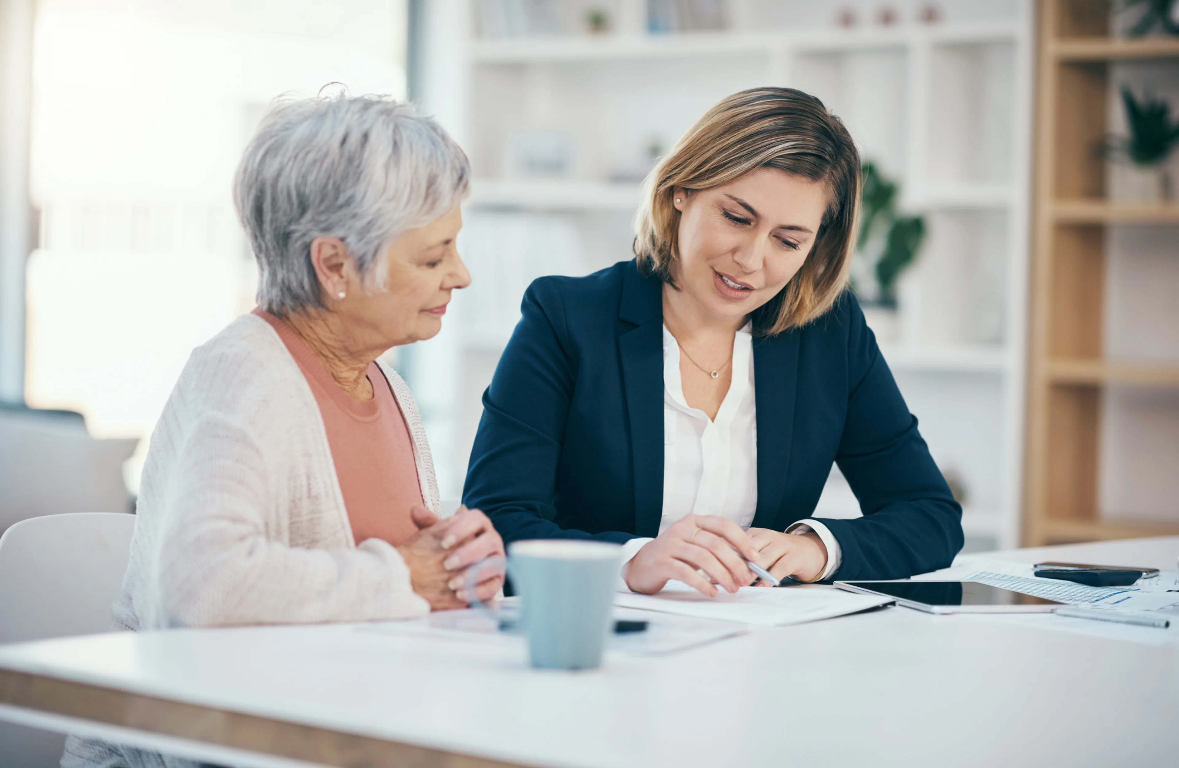 Two women reviewing split dollar insurance