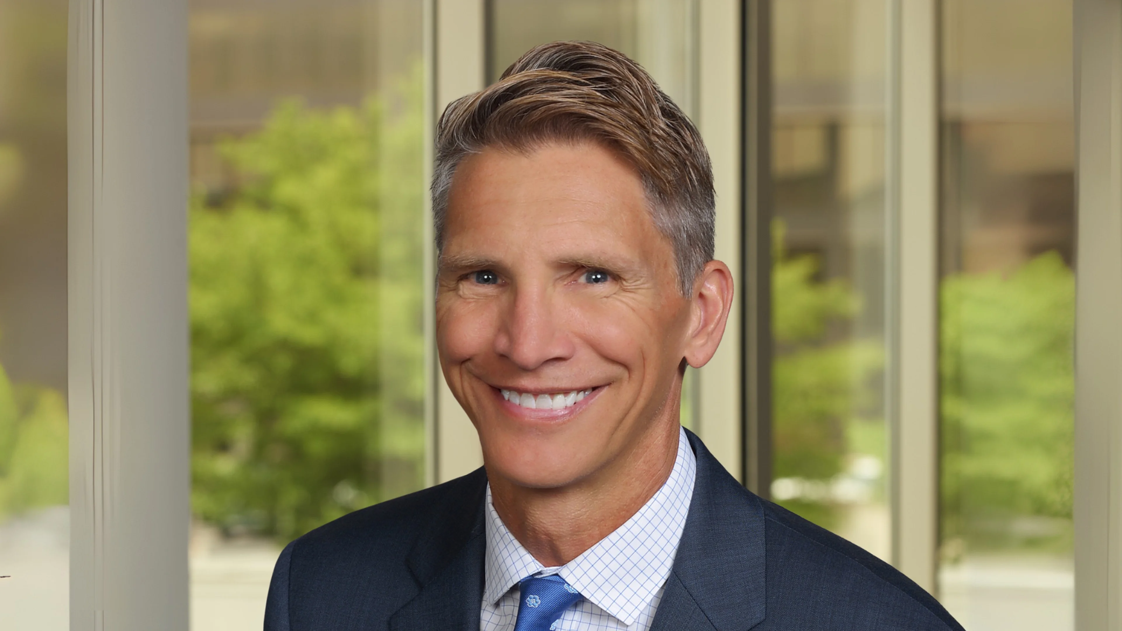 Professional headshot of John Zasada.