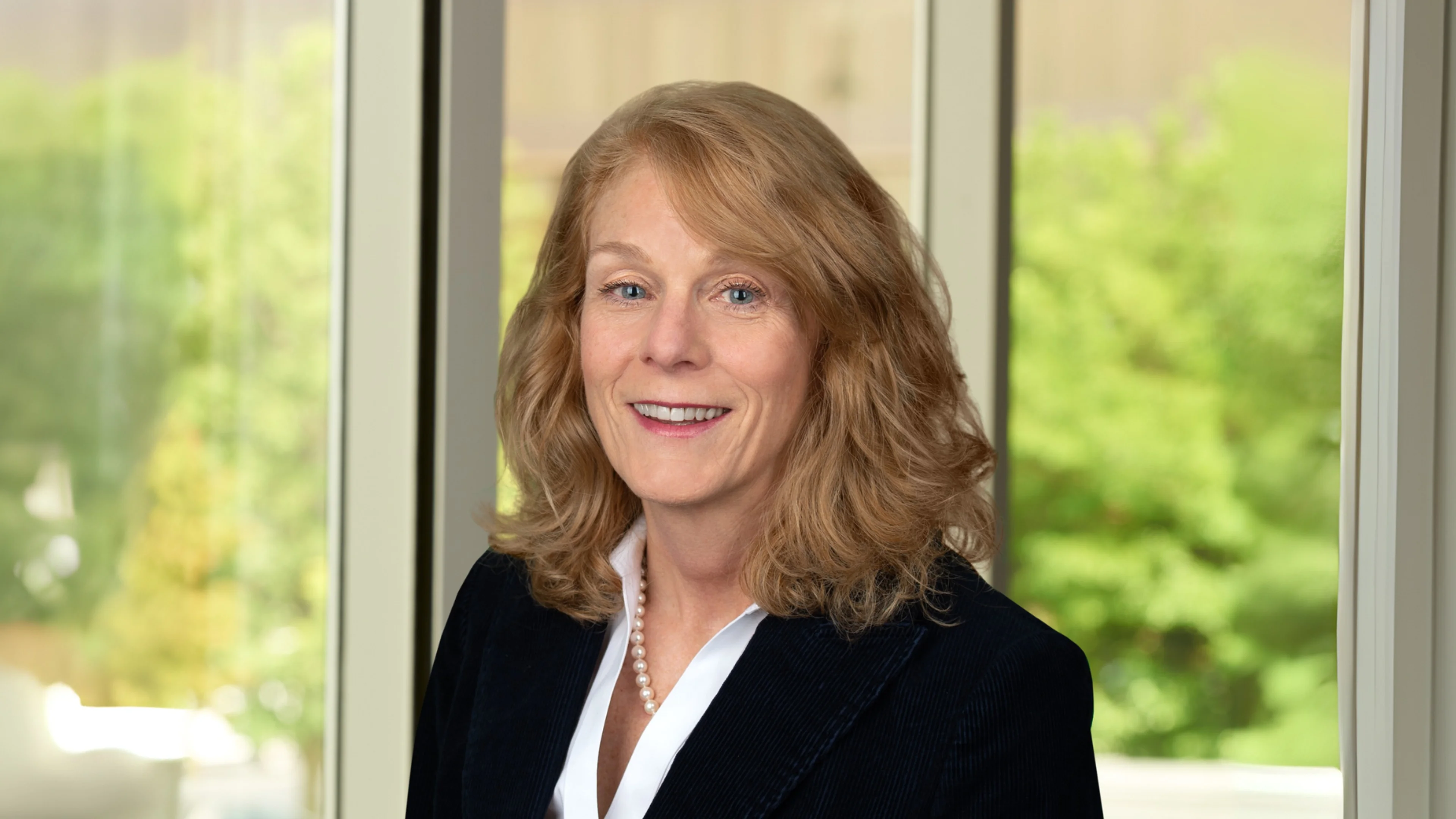 Professional headshot of Leslie Tripp.